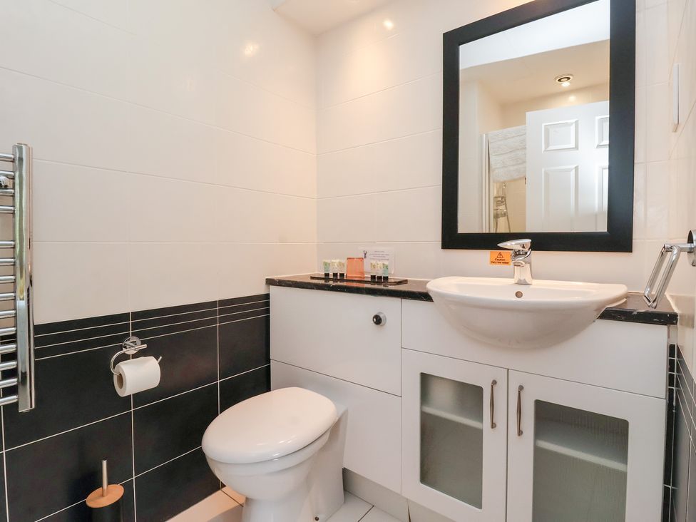 A bathroom with a sink and toilet at Raincliffe Manor in Scarborough