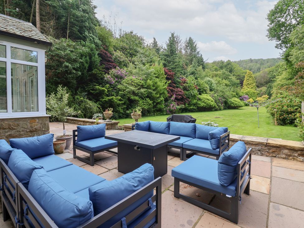 A garden with a seating area and plants at Raincliffe Manor in Scarborough