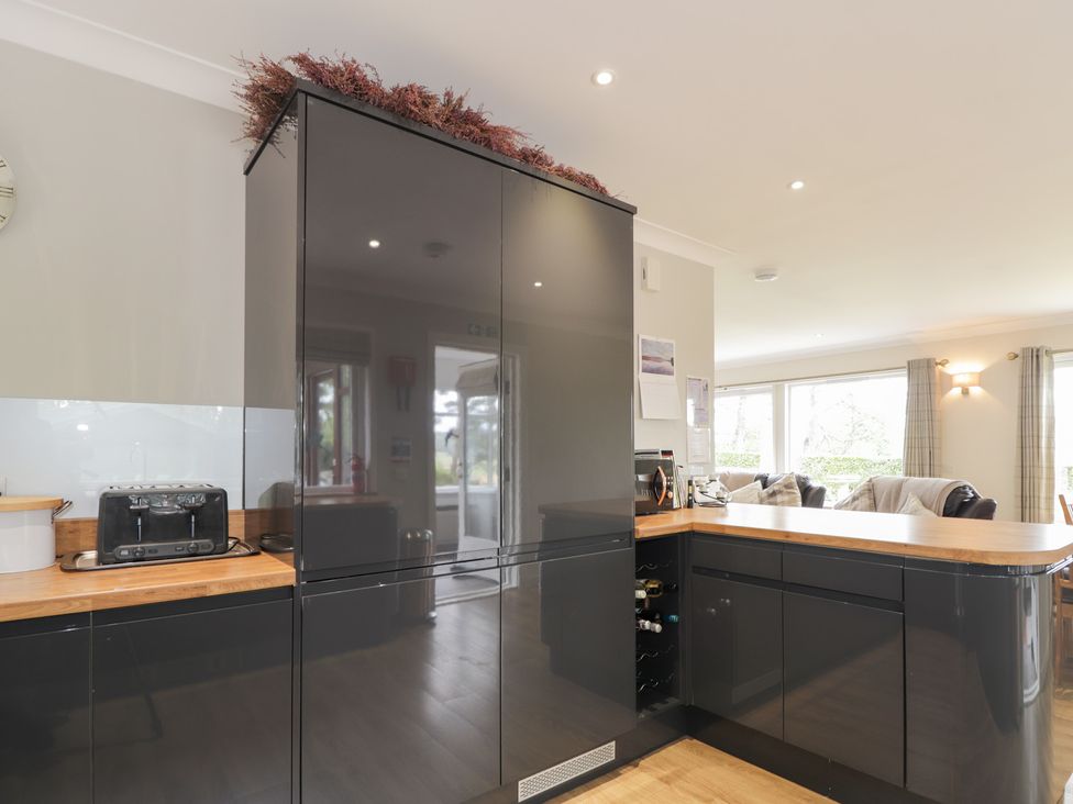 A kitchen with a fridge and toaster at Culreach Lodge near Grantown-on-Spey