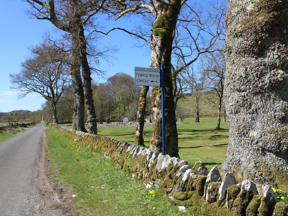 A road with a sign for Temple Wood Circle at Kilmartin View Netherlargie Farm