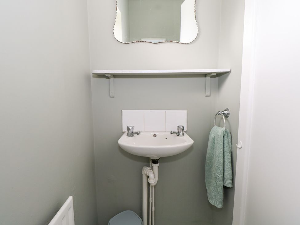 A bathroom with a sink and mirror at Churchfield House, Moygownagh near Crossmolina, County Mayo