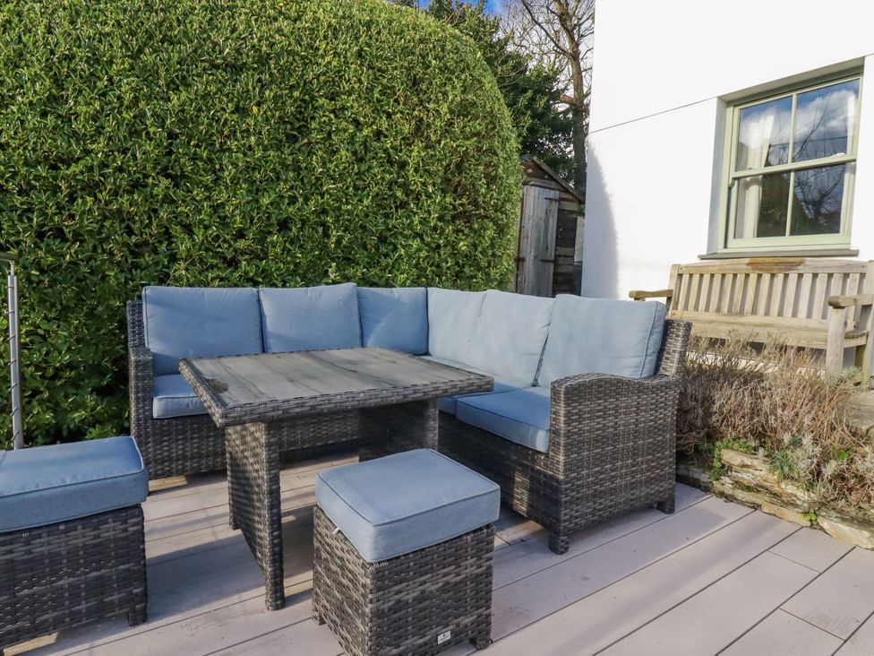 A seating area with a sofa and table at Tresawle in Crantock