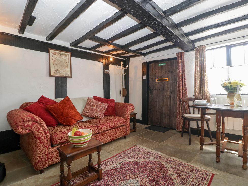 A living room with a sofa and table at Avonmede in Tewkesbury