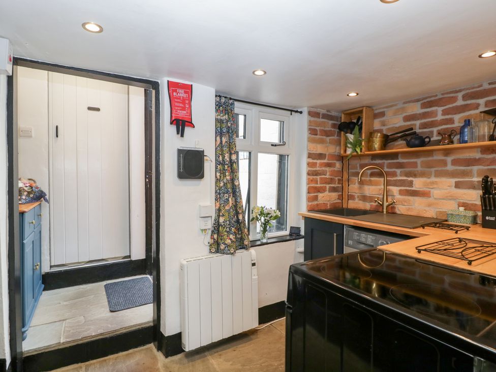 A kitchen with a window and countertop at Avonmede in Tewkesbury