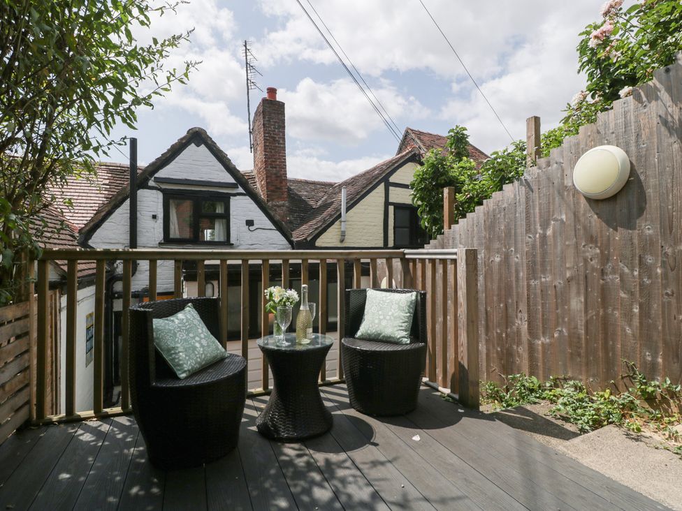 An outdoor seating area with two chairs and a table at Avonmede in Tewkesbury