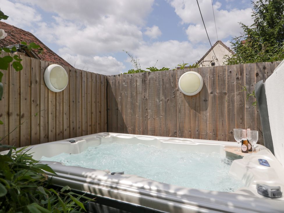A hot tub in an outdoor area at Avonmede Tewkesbury