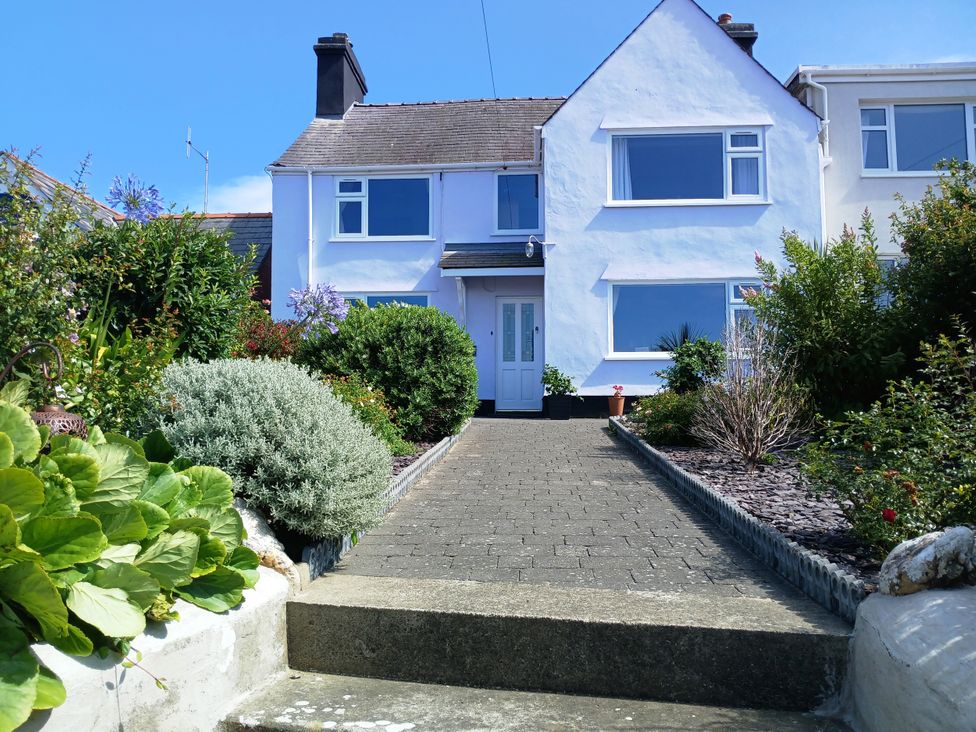 A house with a garden and pathway at Old School House in Cemaes Bay