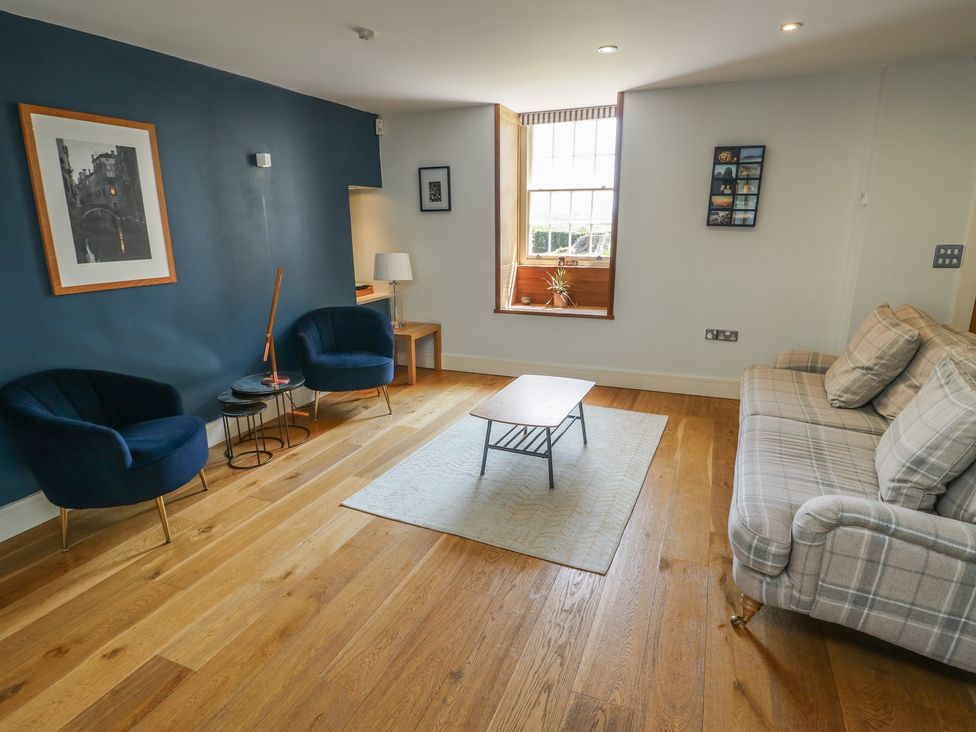 A living room with a sofa and armchairs at Clynnog House Dwyran near Newborough