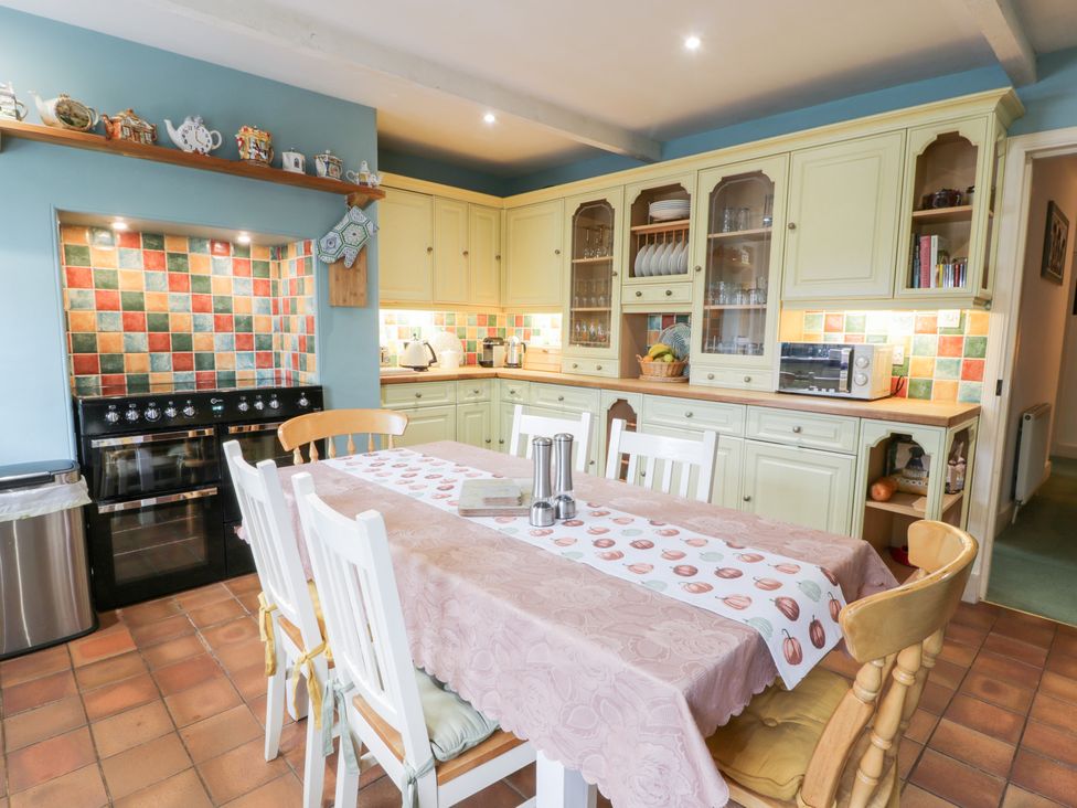 A kitchen with a table and chairs at Strathannan in Moffat