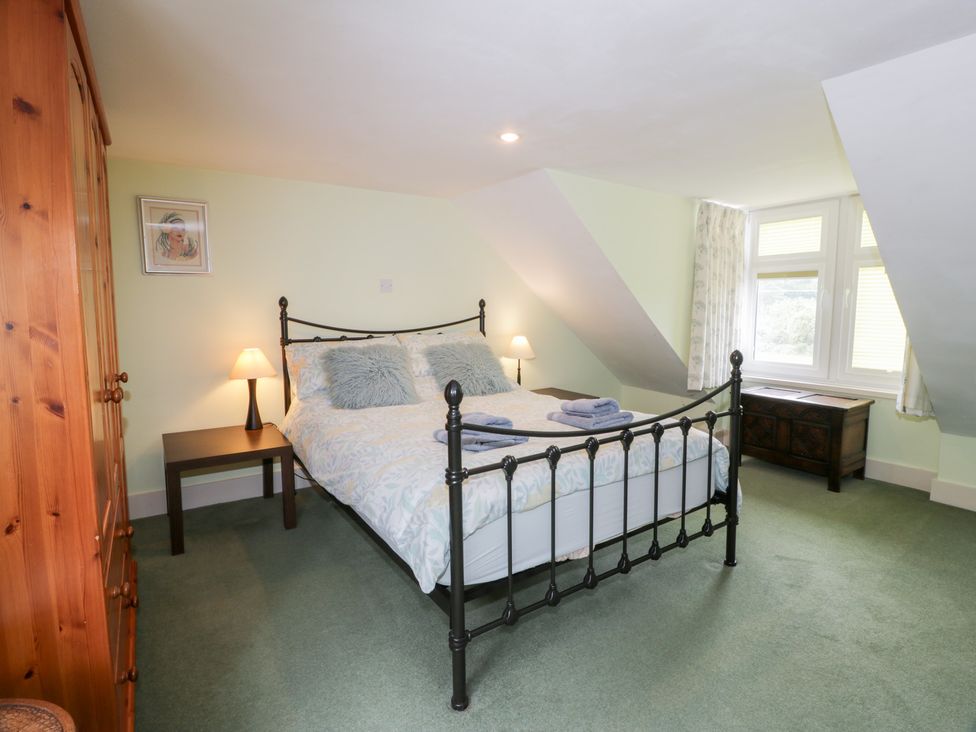 A bedroom with a bed and bedside table at Strathannan in Moffat