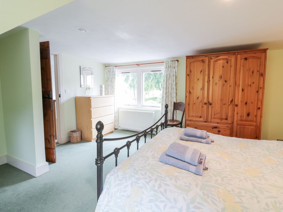 A bedroom with a bed and furniture at Strathannan in Moffat
