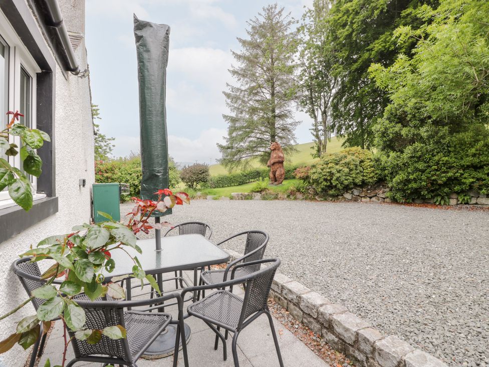 An outdoor area with a table and chairs at Strathannan in Moffat