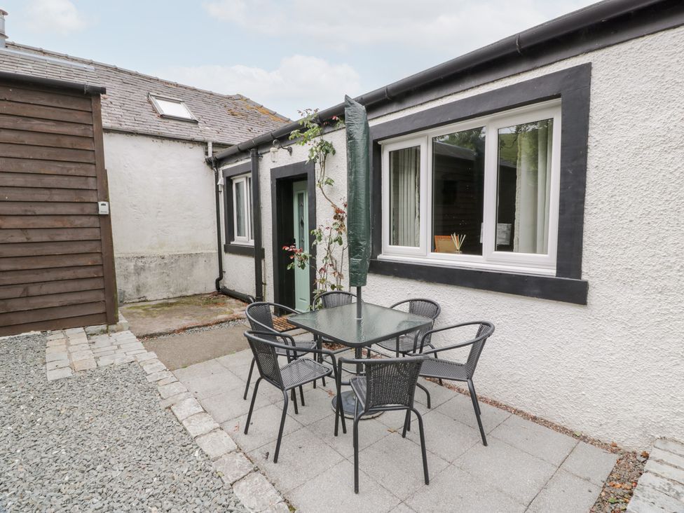 An outdoor area with a table and chairs at Strathannan in Moffat