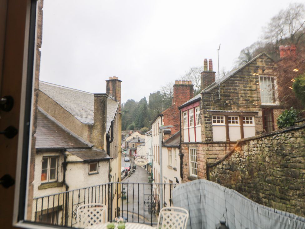 A street view with houses and trees at Kirkham House in Matlock Bath