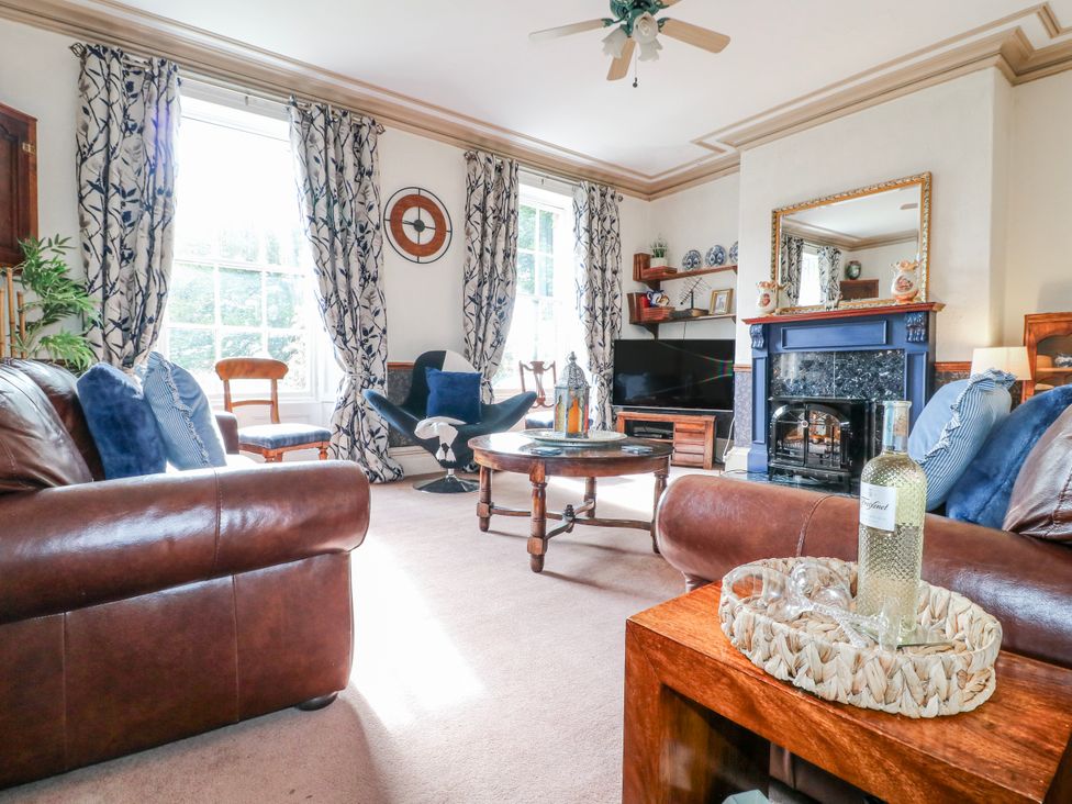 A living room with a sofa and coffee table at Ley Fields Farm in Cheadle