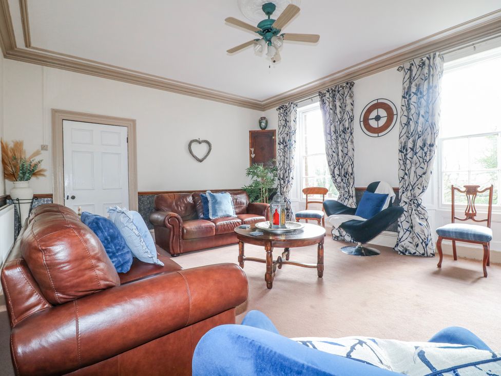 A living room with sofas and a coffee table at Ley Fields Farm in Cheadle
