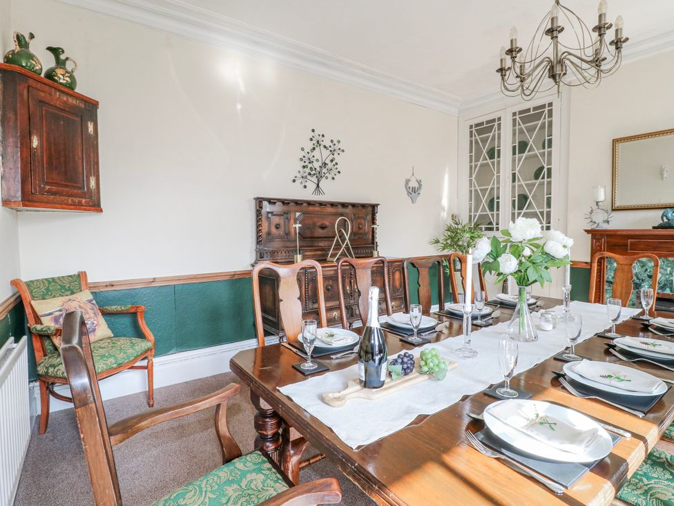 A dining room with a table set for a meal at Ley Fields Farm in Cheadle