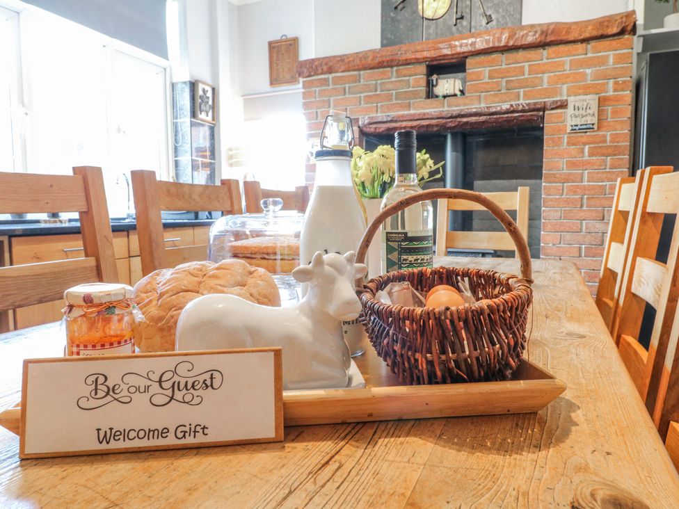 A kitchen with a table set for guests at Ley Fields Farm Cheadle