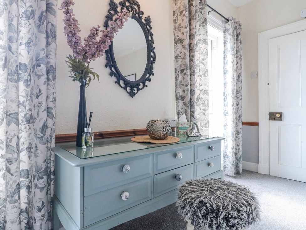 A hallway with a mirror and a dressing table at Ley Fields Farm in Cheadle