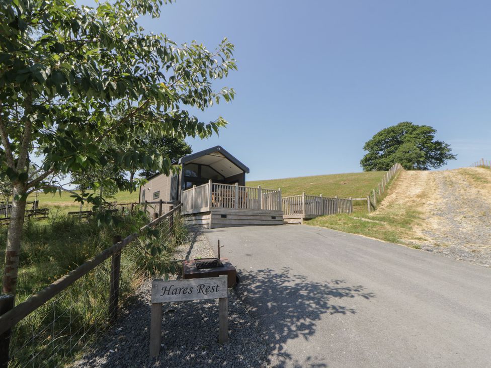 A house with a sign and path at Hares Rest Nantmel near Rhayader