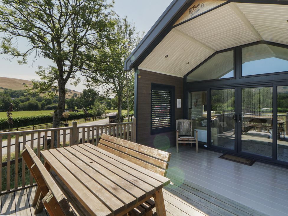 An outdoor area with a table and chairs at Hares Rest in Nantmel near Rhayader