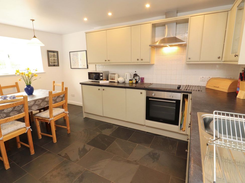 A kitchen with a table and chairs at One Town End in Mungrisdale, Mosedale
