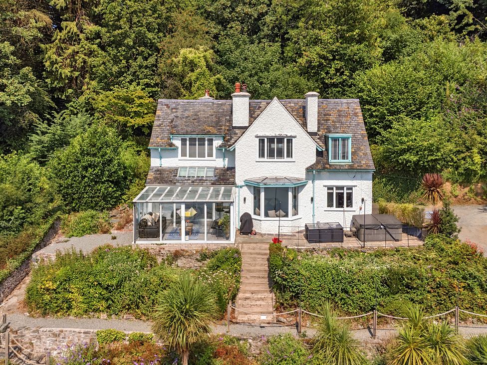 A house with a garden and patio at Afallon in Menai Bridge