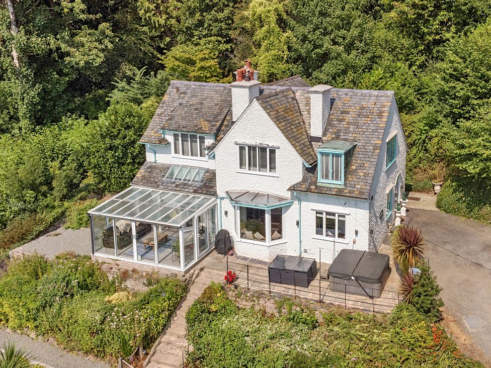 A house with a conservatory and garden at Afallon in Menai Bridge