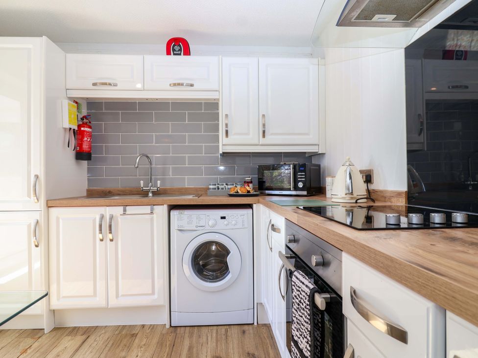 A kitchen with modern appliances and fixtures at 13 Manorcombe Bungalows near Gunnislake