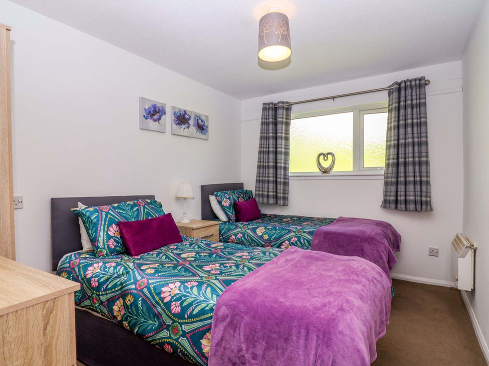 A bedroom with two single beds at 13 Manorcombe Bungalows near Gunnislake