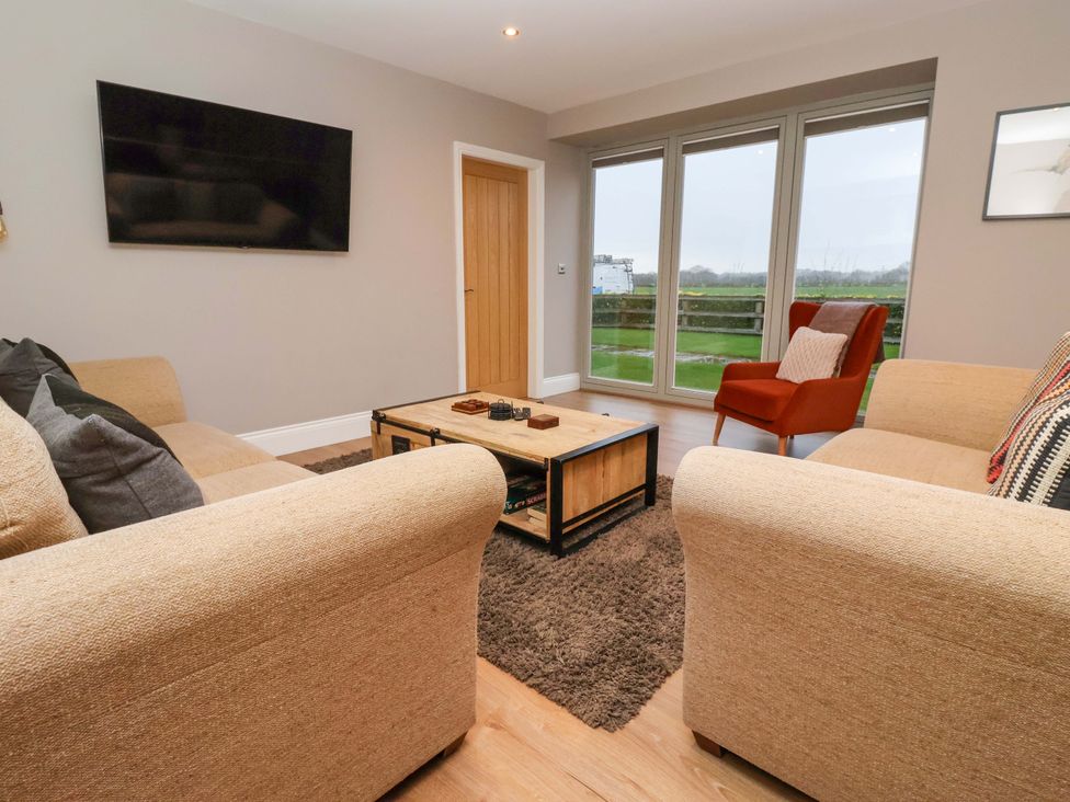 A living room with a coffee table and sofa at The Cart House in Wilberfoss