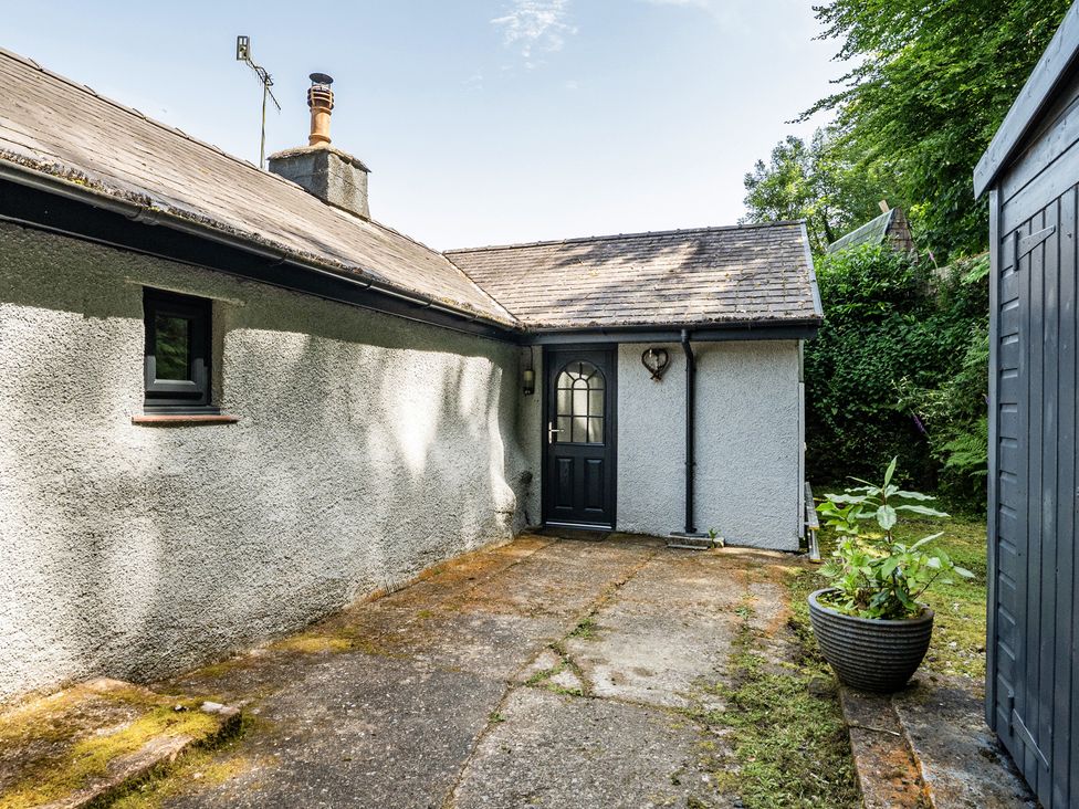 An outdoor view of a house with a door and windows at Tyn Y Ffynnon in Betws-Y-Coed