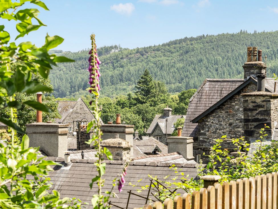 A view of rooftops and a hillside at Tyn Y Ffynnon in Betws-Y-Coed