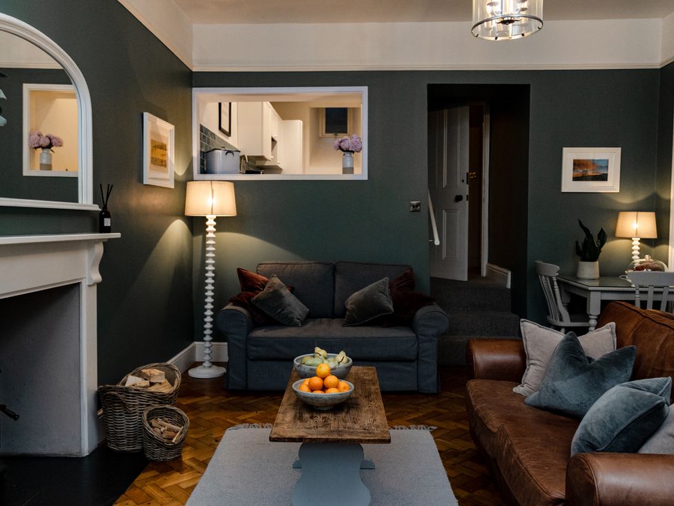 A living room with sofas, a coffee table, and a lamp at Pendle View Luxury Apartment, Giggleswick near Settle