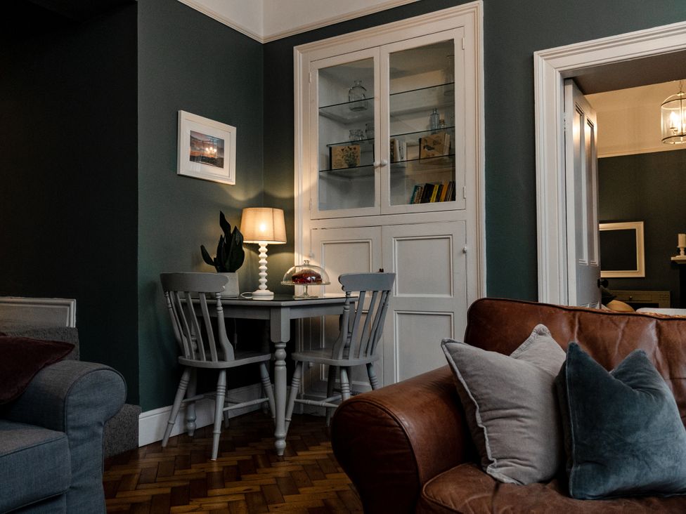 A dining area with a table and chairs at Pendle View Luxury Apartment in Giggleswick near Settle