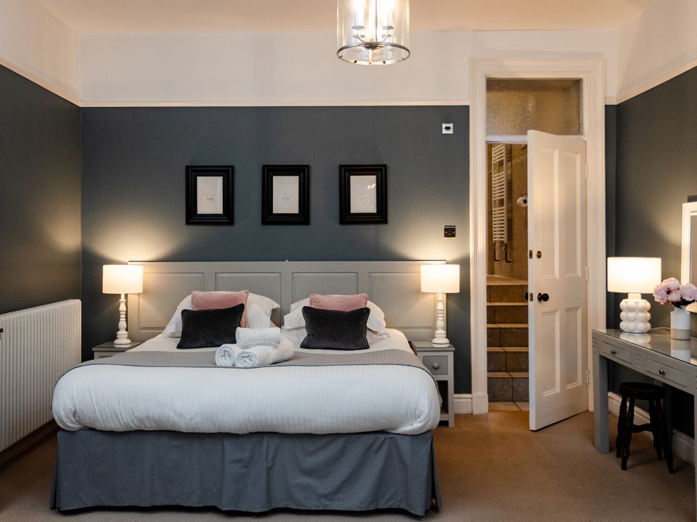 A bedroom with a bed and nightstands at Pendle View Luxury Apartment in Giggleswick near Settle