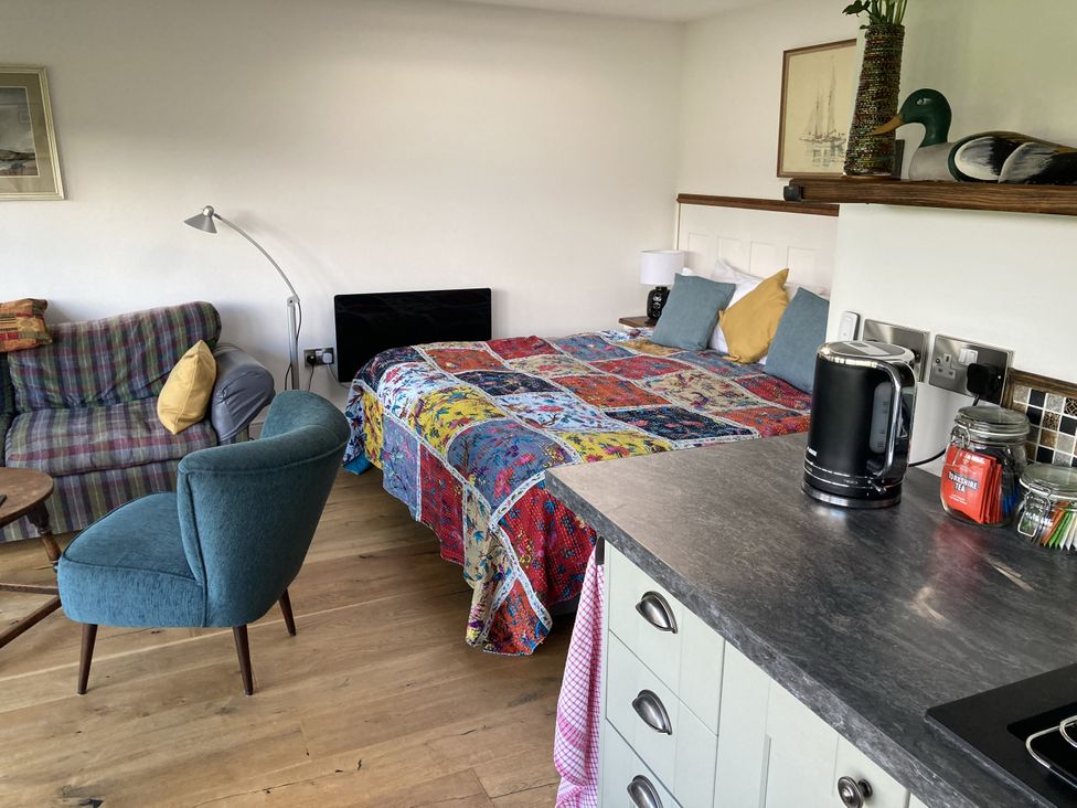 A studio with a bed and sofa at The Sett on the Wharfe in Skipton