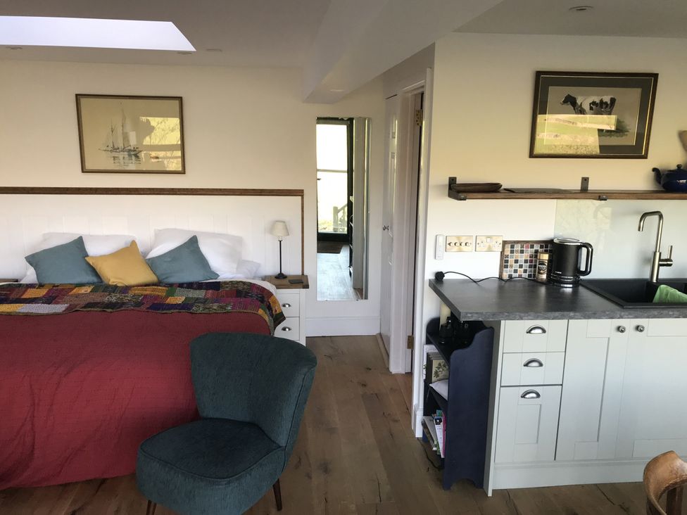 A bedroom with a bed and kitchen unit at The Sett on the Wharfe in Skipton