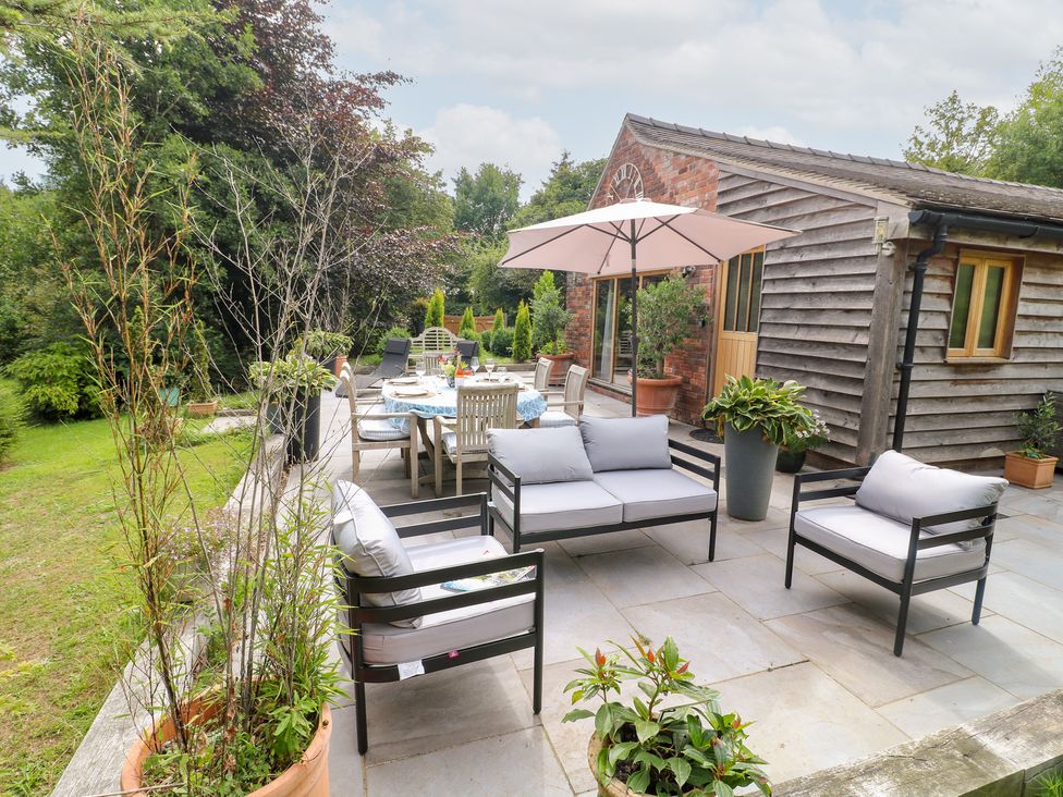 An outdoor seating area with furniture at Ladycroft Barn Ashbourne