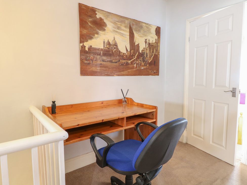 A work area with a desk and chair at 4 Trafalgar Square, Great Yarmouth