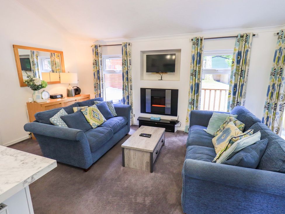 A living room with a sofa and coffee table at Forest Pines Lodge Beech Hill 10, Fallbarrow Park near Bowness on Windermere