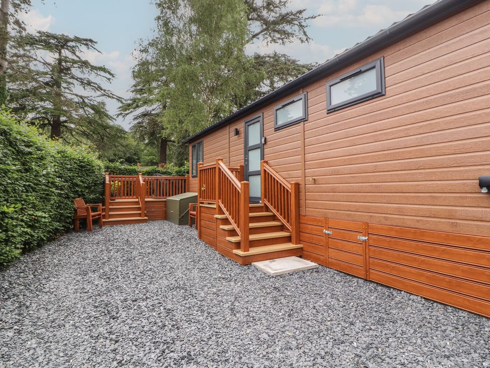 An outdoor area featuring a wooden deck and steps at Beech Grove Lodge Glade 17, Fallbarrow Park near Bowness on Windermere