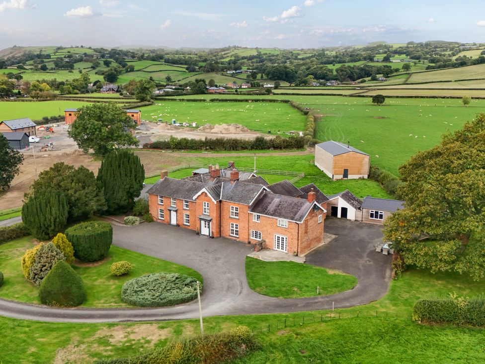 A house with a driveway and garden at Bodaioch Hall Trefeglwys near Caersws