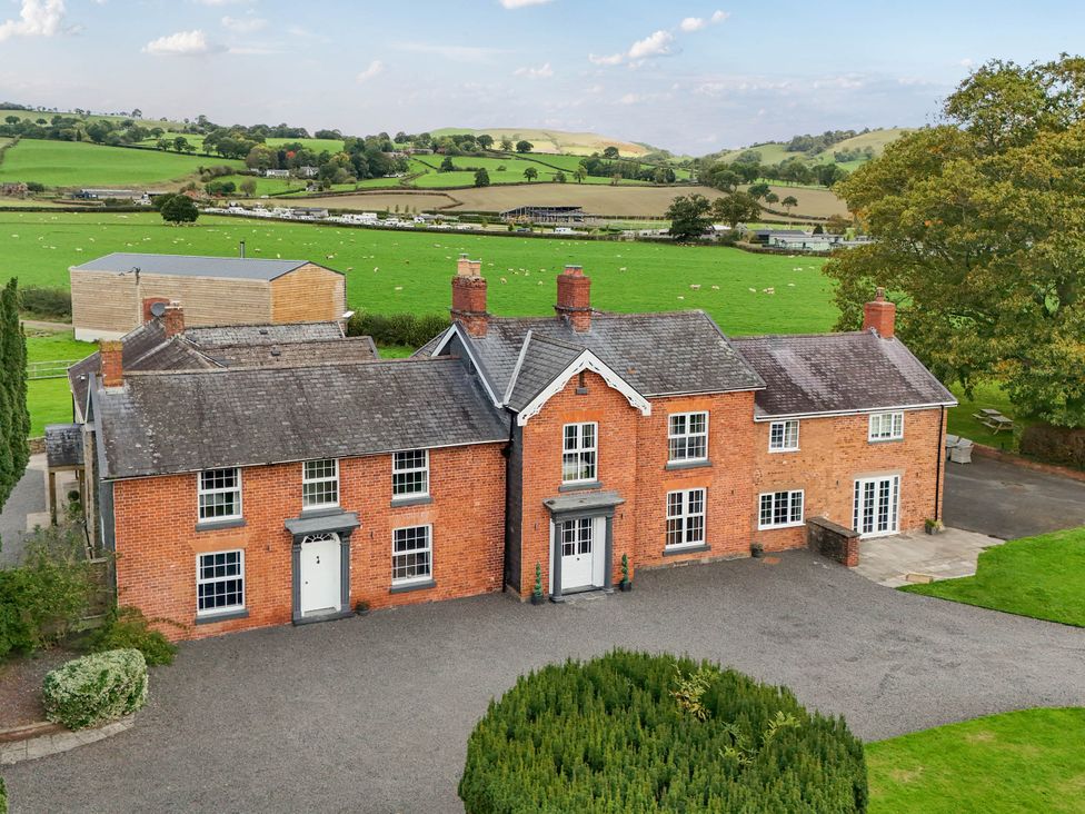 A house with a garden and driveway at Bodaioch Hall Trefeglwys near Caersws