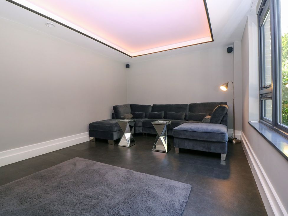 A living room with a sofa and coffee table at Thornbury in Barnard's Green, Malvern