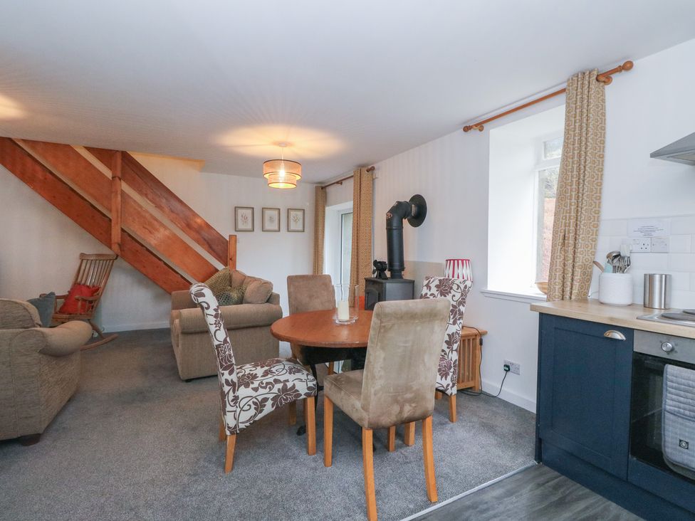 A living room with a table and chairs at Willow Killean Farmhouse Cottages near Inveraray