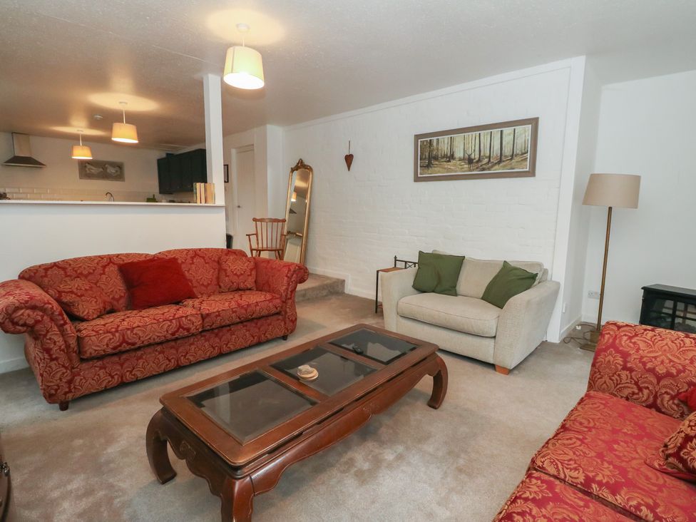 A living room with sofas and a coffee table at Hawthorn near Killean Farmhouse Cottages near Inveraray