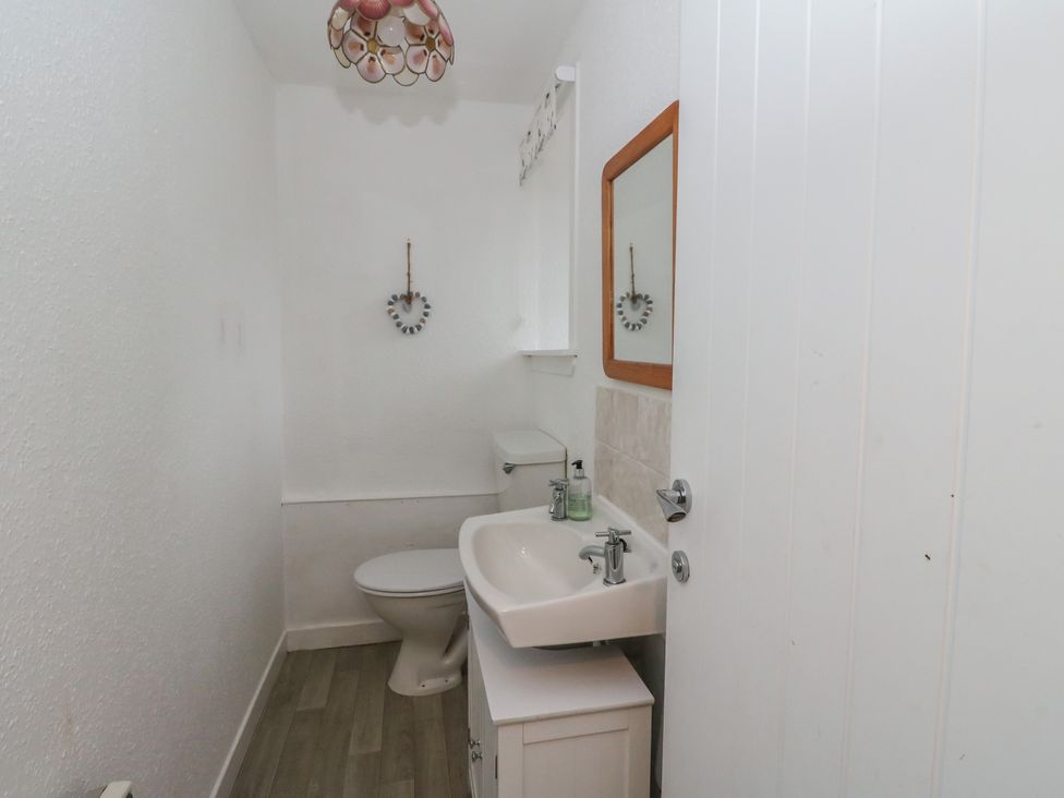A bathroom with a toilet and sink at Hawthorn near Killean Farmhouse Cottages Inveraray