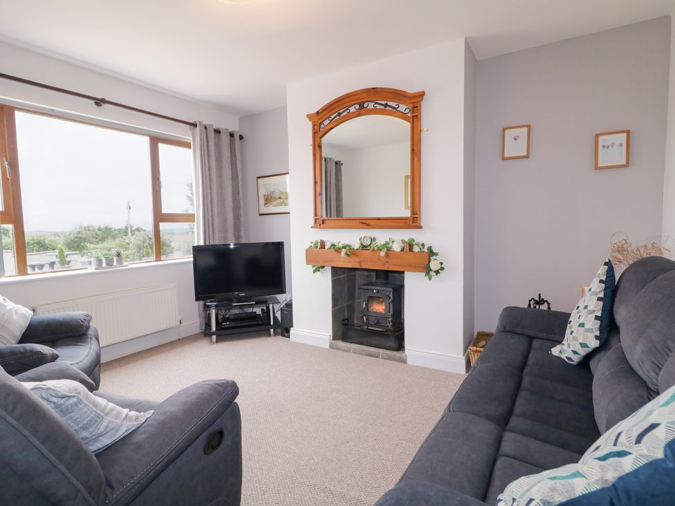 A living room with a sofa and television at Ard na Gréine, Glenties, County Donegal