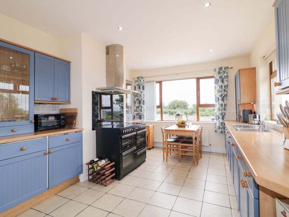 A kitchen with a table and chairs at Ard na Gréine, Glenties, County Donegal